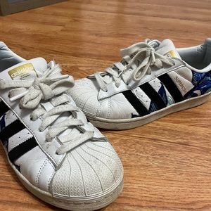 Adidas superstar with flower pattern